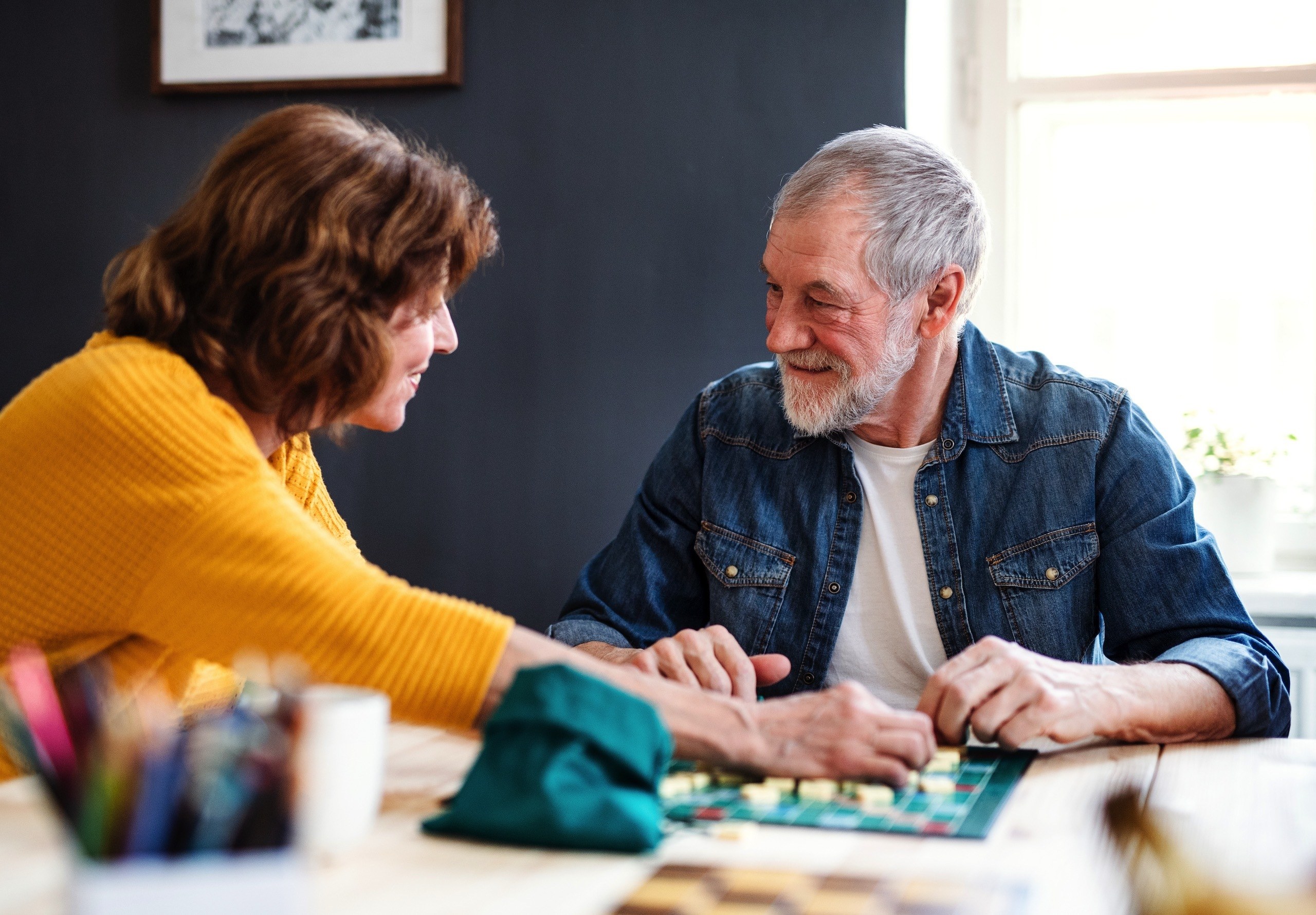 Older couple playing board game